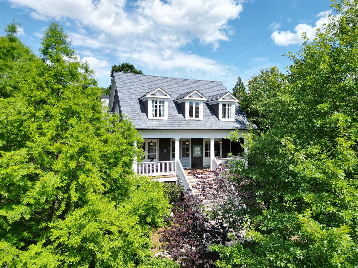 Discover your dream retreat in Serenbe! This stunning 6 bed, 4.5 bath cottage offers 5,207 sqft of thoughtfully designed living space with an open floor plan perfect for gatherings of all sizes.⁠
⁠
Enjoy luxury amenities including a heated pool & hot tub, projector room, gym, rec room, private office, and custom dog wash station! Relax on your expansive front porch or spend time in the fully fenced backyard with covered porch and private courtyard.⁠
⁠
With Serenbe Farms directly behind you, fresh organic vegetables are just moments away! Enjoy direct access to shops, restaurants, and over 20 miles of nature trails plus all of Serenbe's wellness amenities. This isn't just a home—it's the sustainable, community-focused lifestyle you've been dreaming of!⁠
⁠
👀 See more details about this home by tapping the 🔗 in our bio, and then tapping this post!